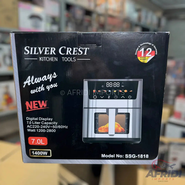 Silver Crest air fryer with a 7.0-liter capacity, digital display, 1400W power, and a stainless steel finish.