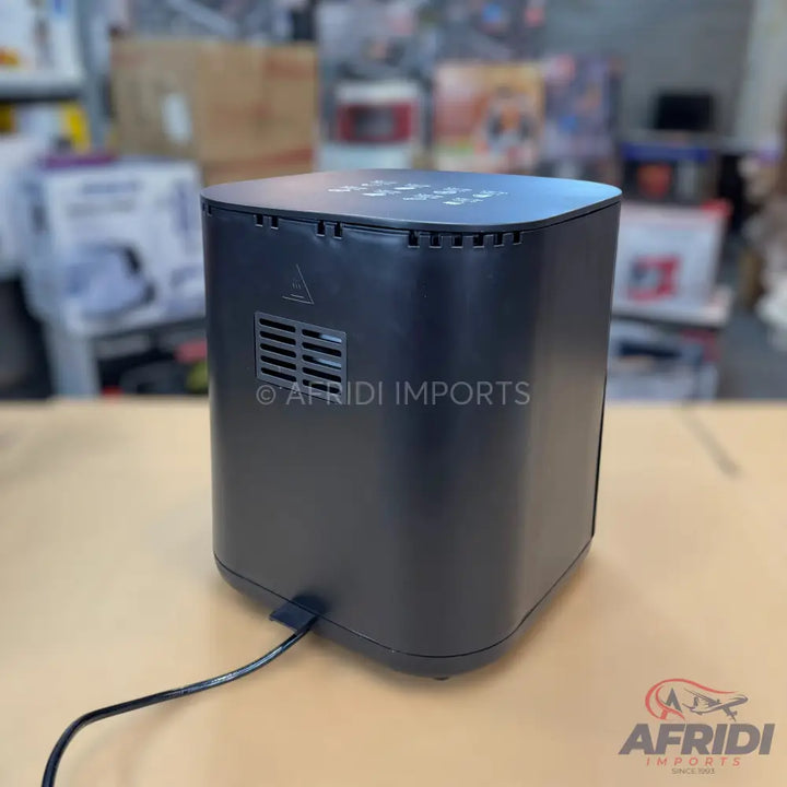 Black electric air fryer with a power cord.