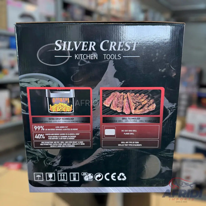 A product box for kitchen tools, featuring ’Silver Crest’ branding, highlighting ’Extra Crisp Technology’ for items like french fries, and ’Grill Technology’ for grilling meat, with clear icons for packaging instructions.