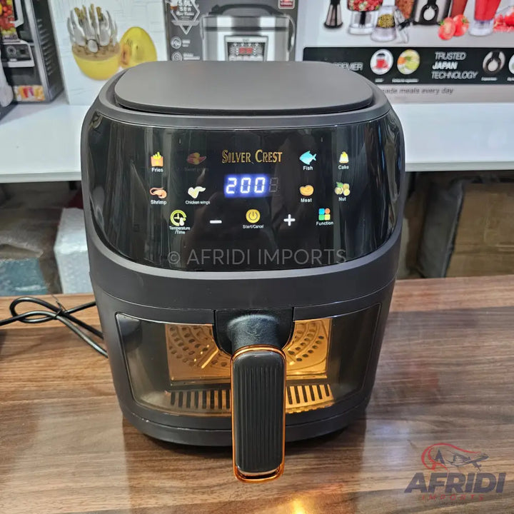 Black Silver Crest air fryer with a clear viewing window and digital display.