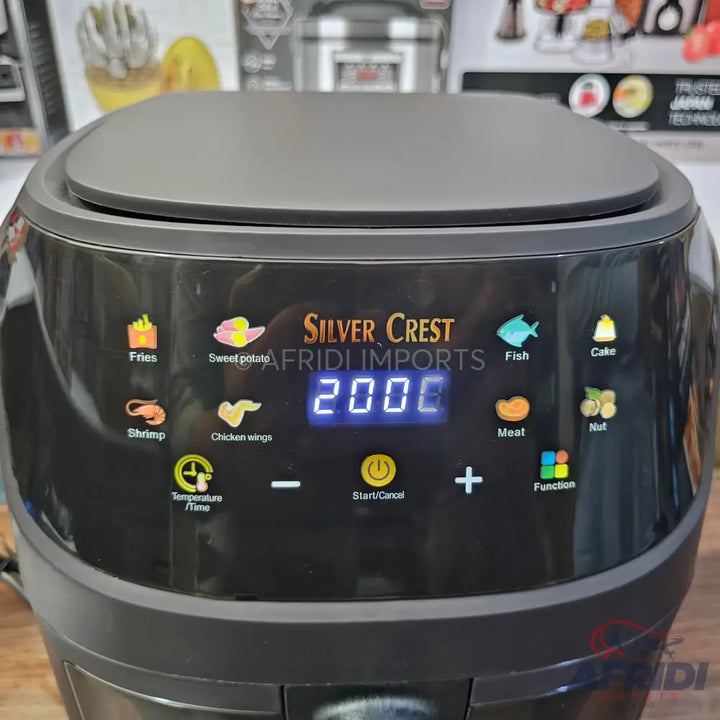 Black digital air fryer with preset cooking options.