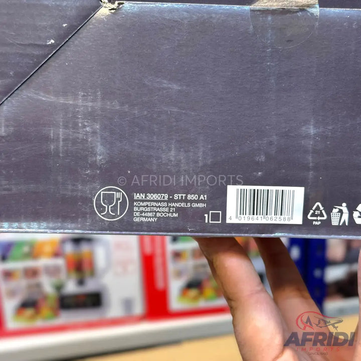 Product packaging for a kitchen appliance with a barcode and manufacturer information.