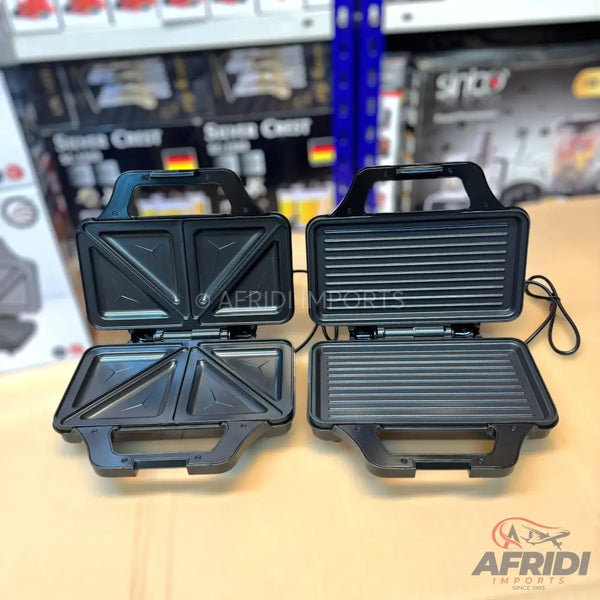 Two black electric sandwich makers, one with triangular compartments and the other with griddle plates.