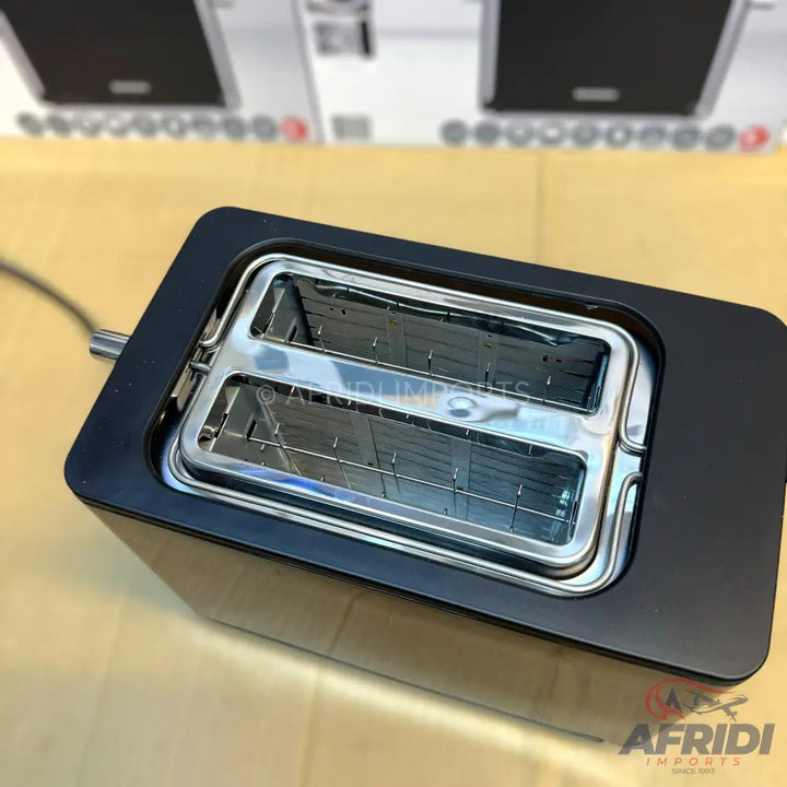A black two-slice toaster with metallic slots.