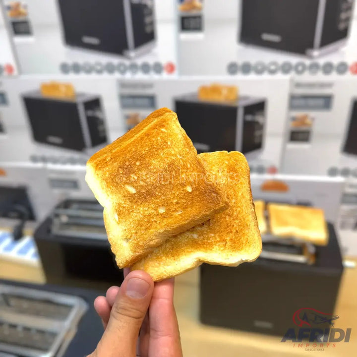 Two slices of golden-brown toasted bread, held by a hand.