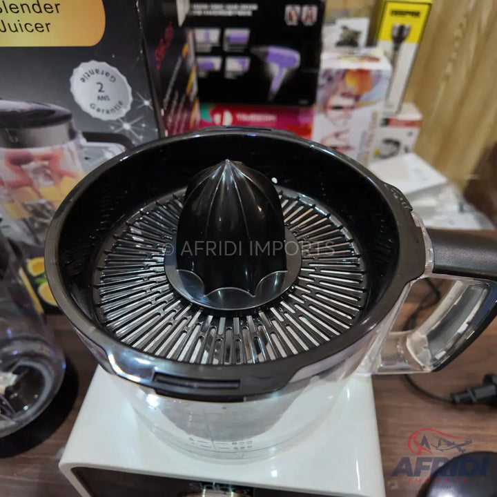 Black and white electric citrus juicer with a clear handle and a ribbed reamer.