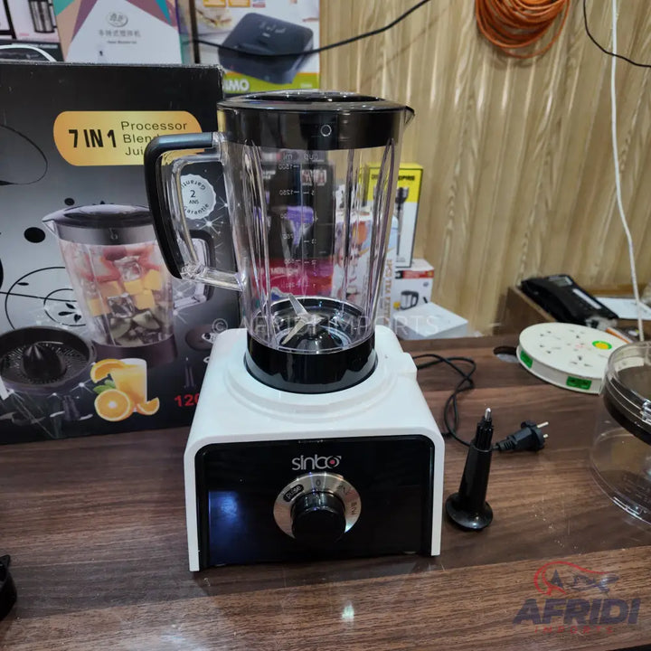A white and black multi-functional food processor with a clear blender jar and speed dial.