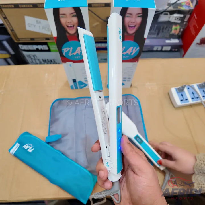 White and blue ceramic hair straightener with digital temperature display.
