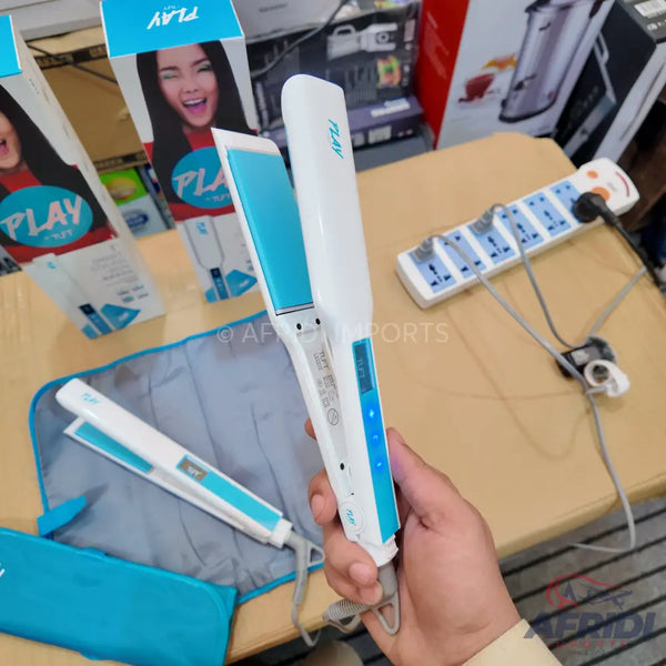 A white and turquoise hair straightener with a digital display.