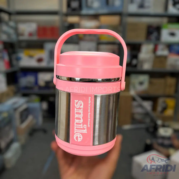 Pink and silver insulated food container with a handle.