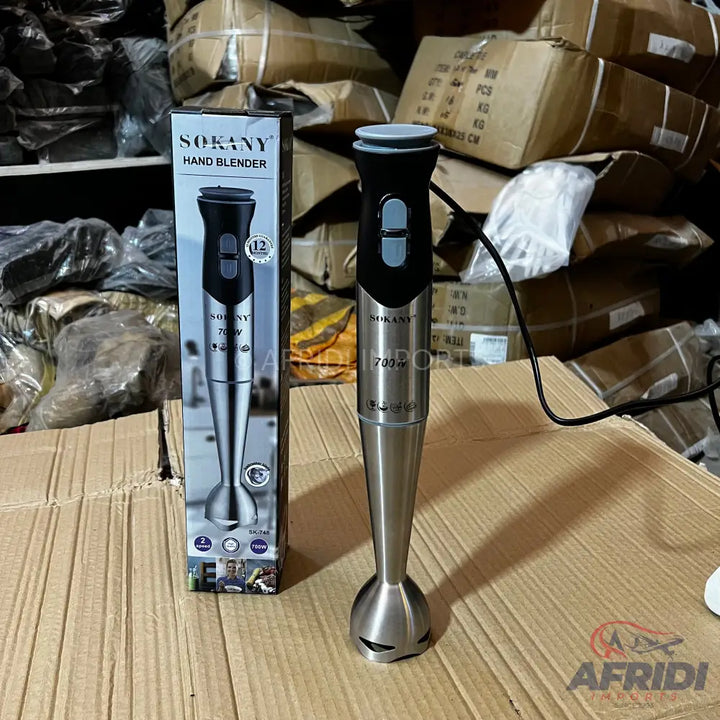 A silver and black Sokany 700W hand blender with two-speed settings, packaged in its box.