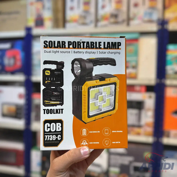 A yellow and black solar portable lamp with a built-in toolkit.