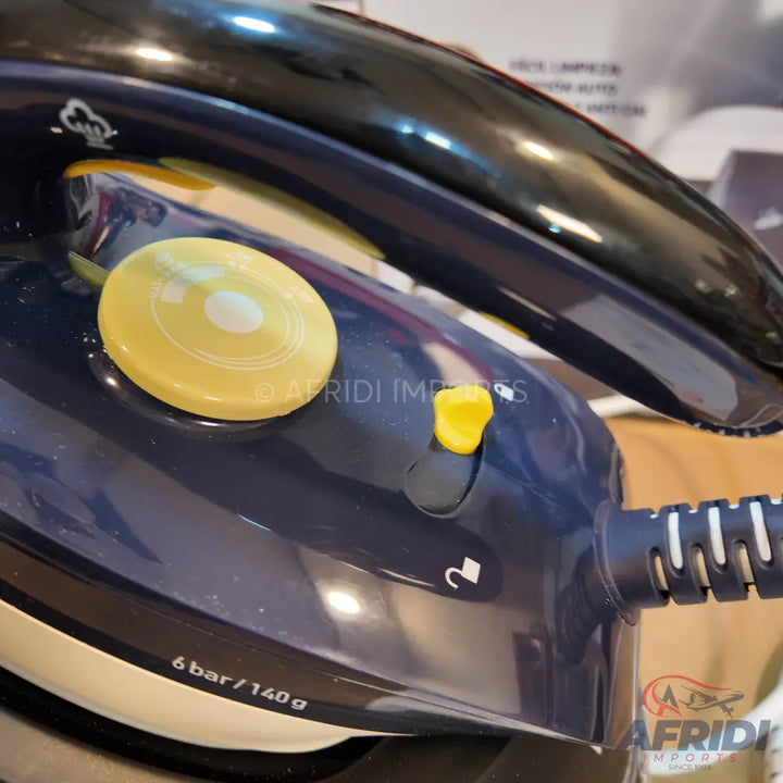 Blue and black steam iron with a yellow control dial and switch.