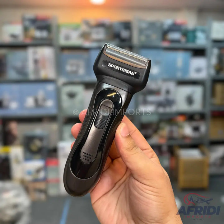 Black handheld electric shaver with a foil head.
