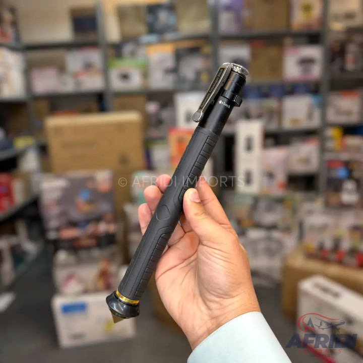 Black multi-tool pen with a tactical tip.