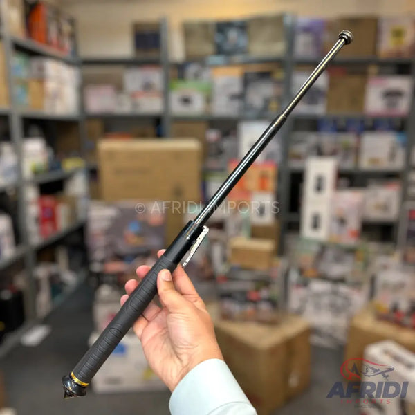Black extendable baton with a textured grip and pointed pommel.
