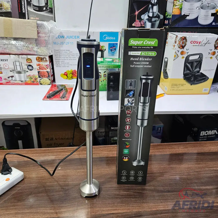 A stainless steel hand blender with a black handle and a blue indicator light.