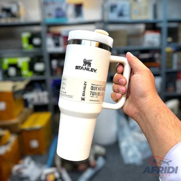 White Stanley Quencher H2.0 FlowState tumbler with a handle.