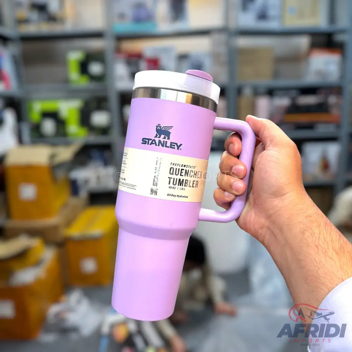 Purple Stanley Quencher FlowState Tumbler with a handle.