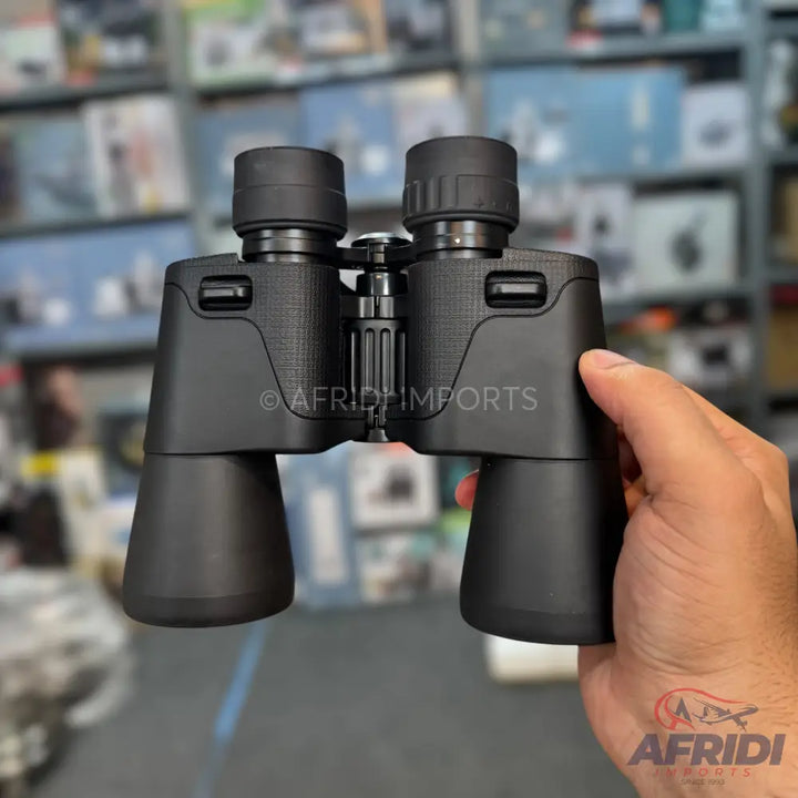 Black binoculars with textured grip and adjustable eyepieces.