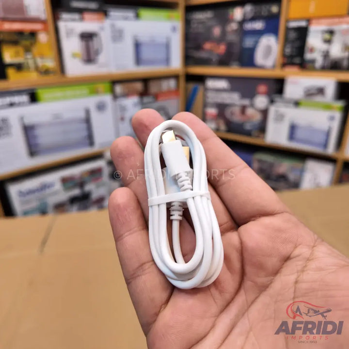 A coiled white USB-A to Lightning cable.