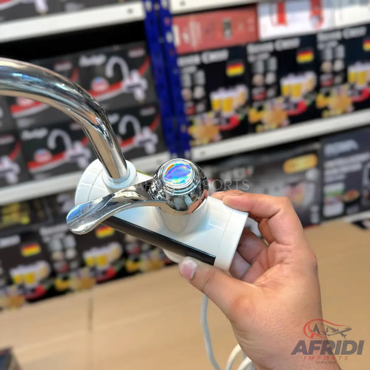 Chrome kitchen faucet with a single lever handle and iridescent temperature indicator.