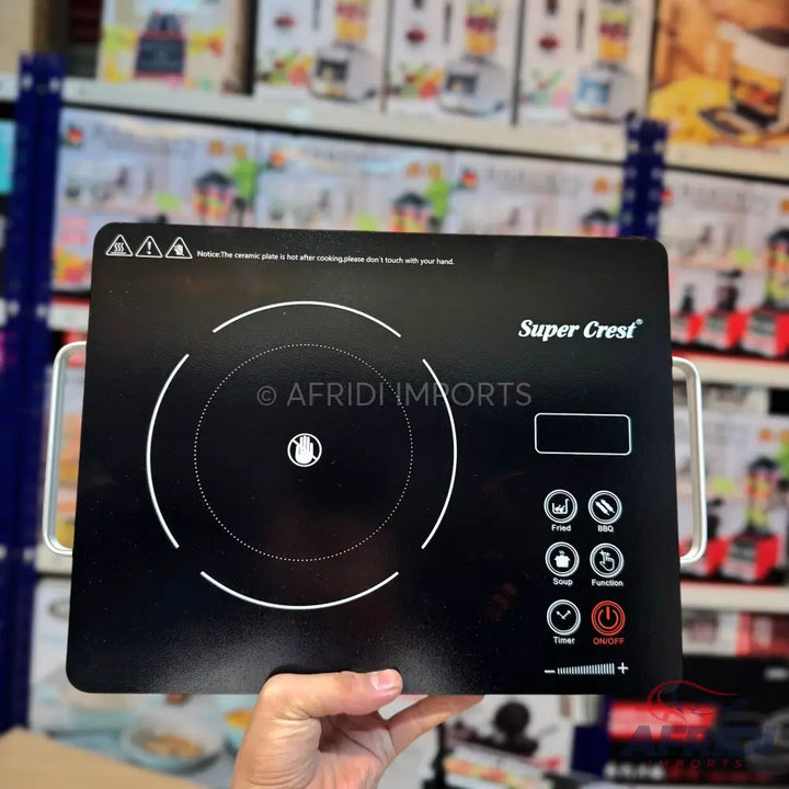 Black induction cooktop with touch controls and a digital display.