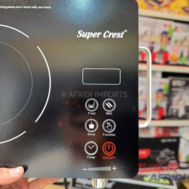 Black induction cooktop with touch controls for various cooking functions and a timer.