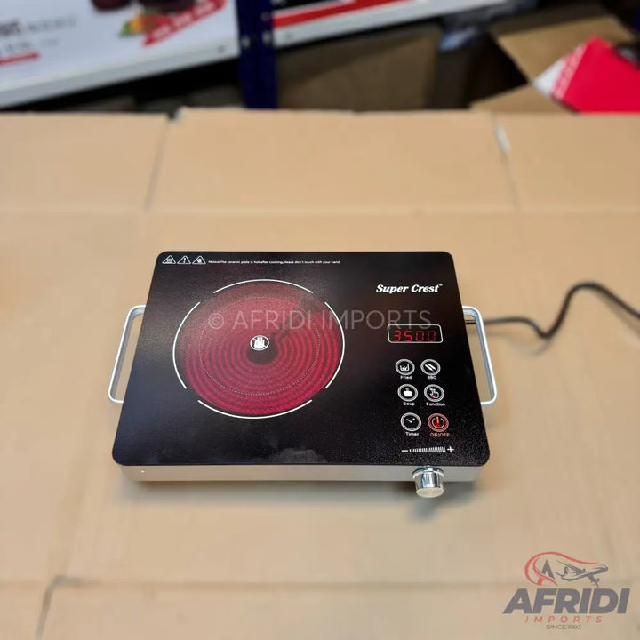Black electric induction cooktop with a single red heating element and digital controls.