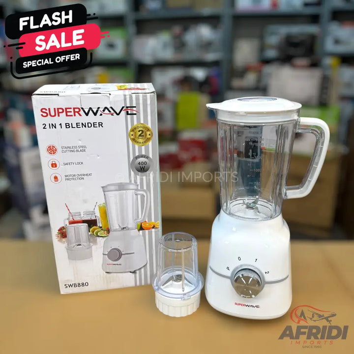 A white Superwave 2-in-1 blender with a main pitcher, a smaller grinding cup, and its original packaging.