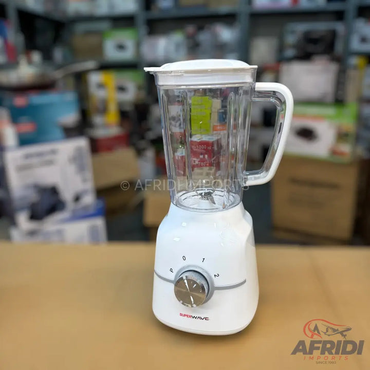 White electric blender with a clear pitcher and a silver control knob.