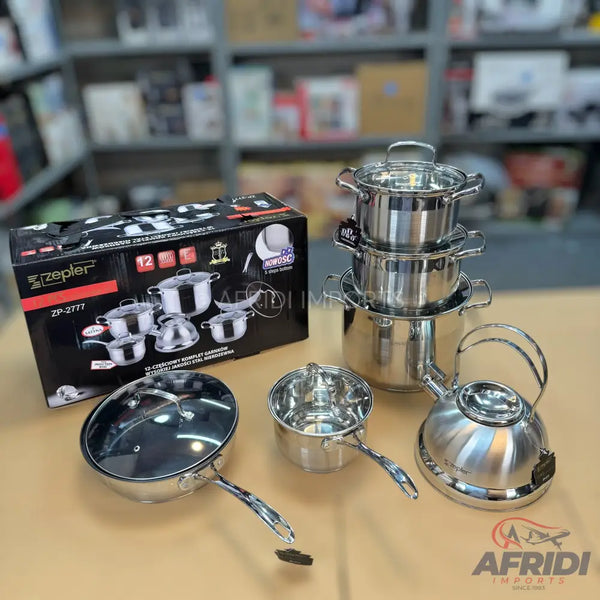 A complete set of shiny stainless steel cookware, including pots, a pan, and a kettle.