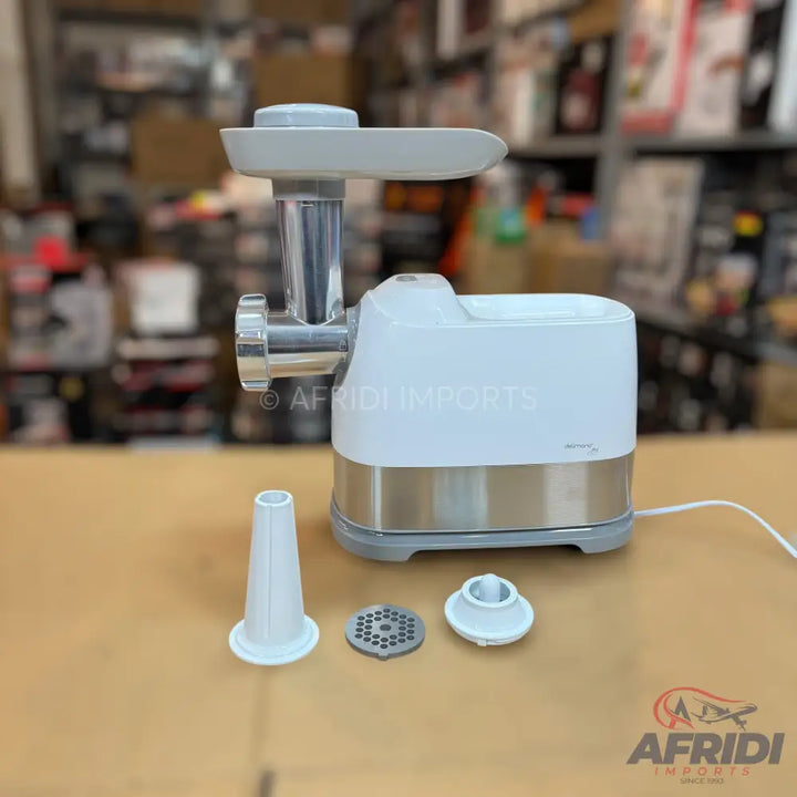 White and silver electric meat grinder with attachments.
