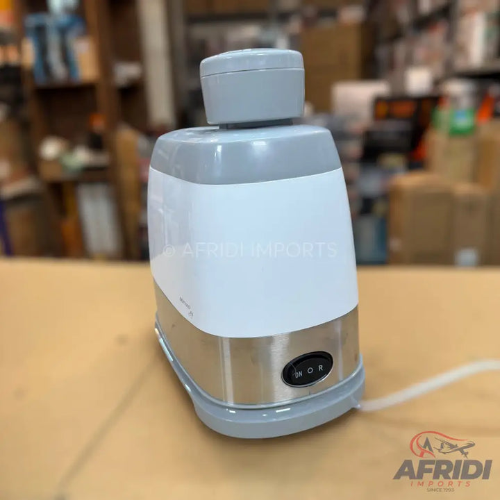 White and silver electric appliance with a gray top and an ’ON OR’ button.