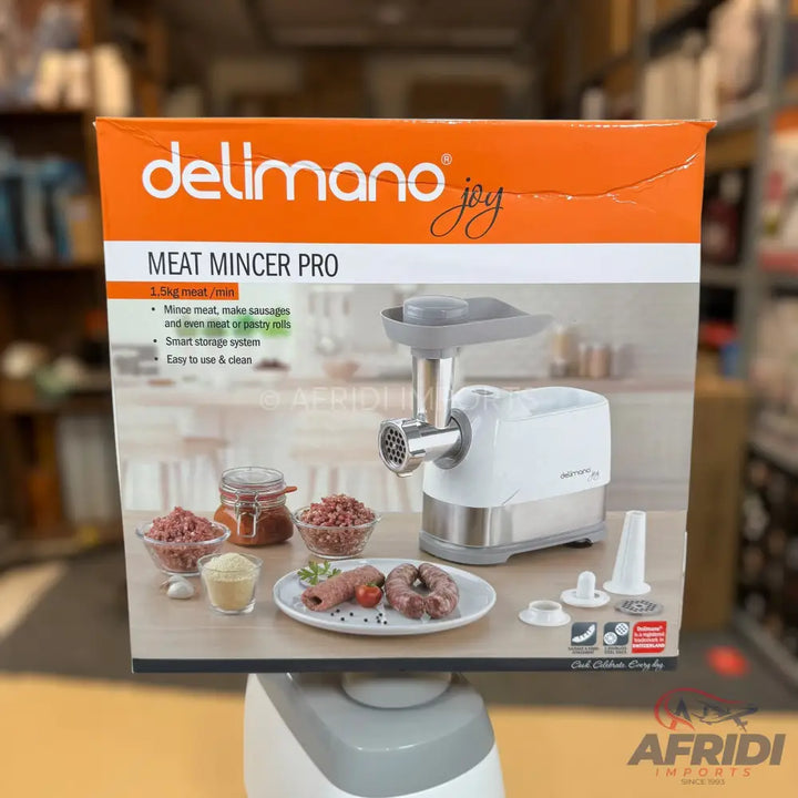 Boxed Delimano Joy Meat Mincer Pro with accessories and prepared meat.