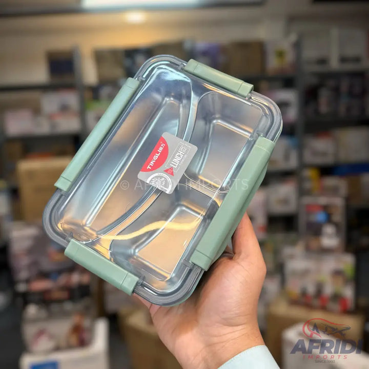 Stainless steel lunchbox with two compartments and a clear, clip-on lid.