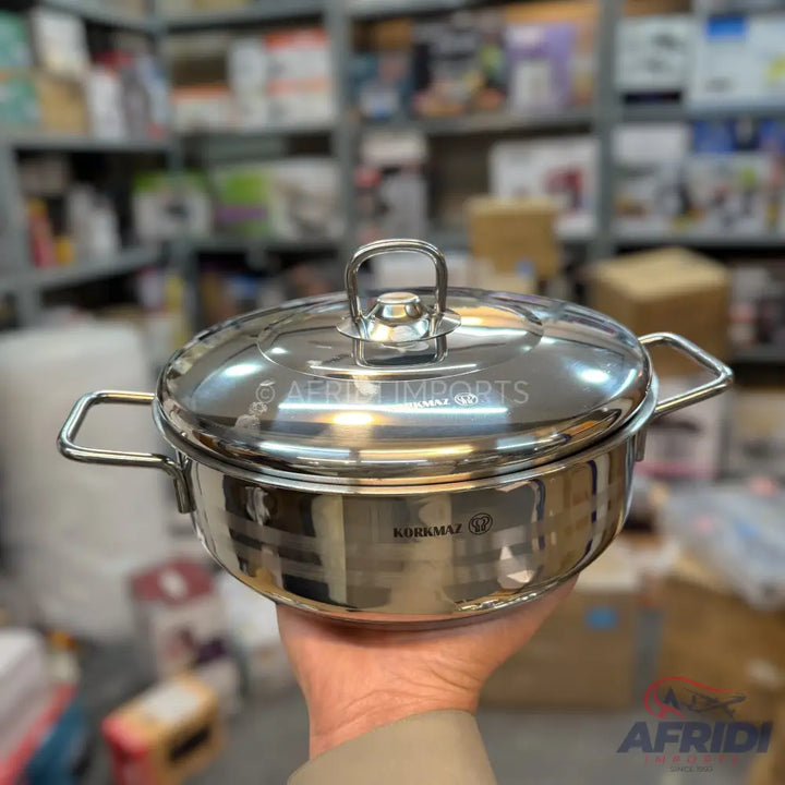 Shiny stainless steel cooking pot with lid and two loop handles.