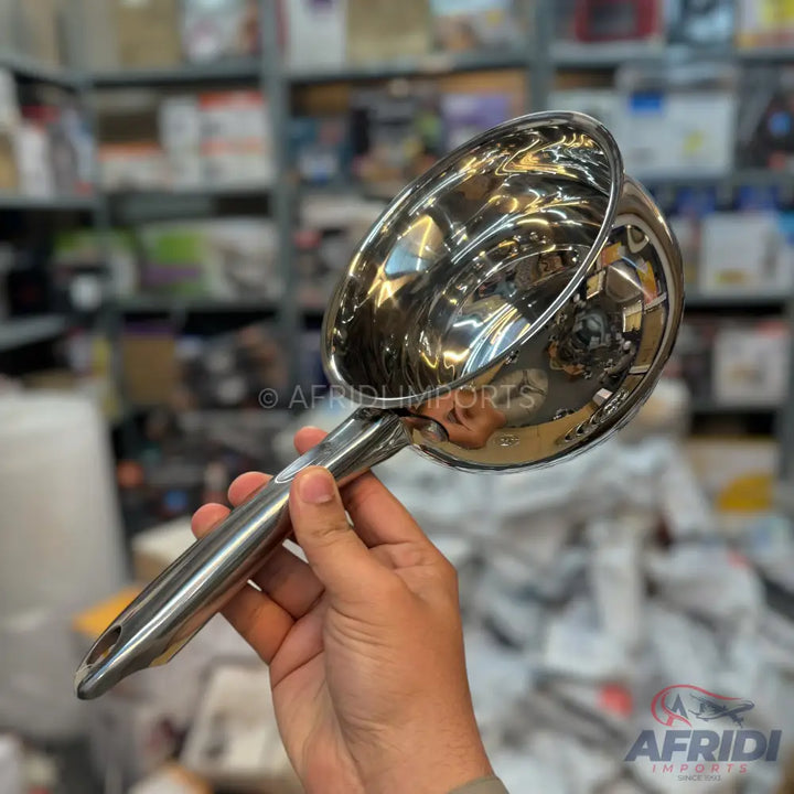 Shiny metal scoop with a hollow handle.