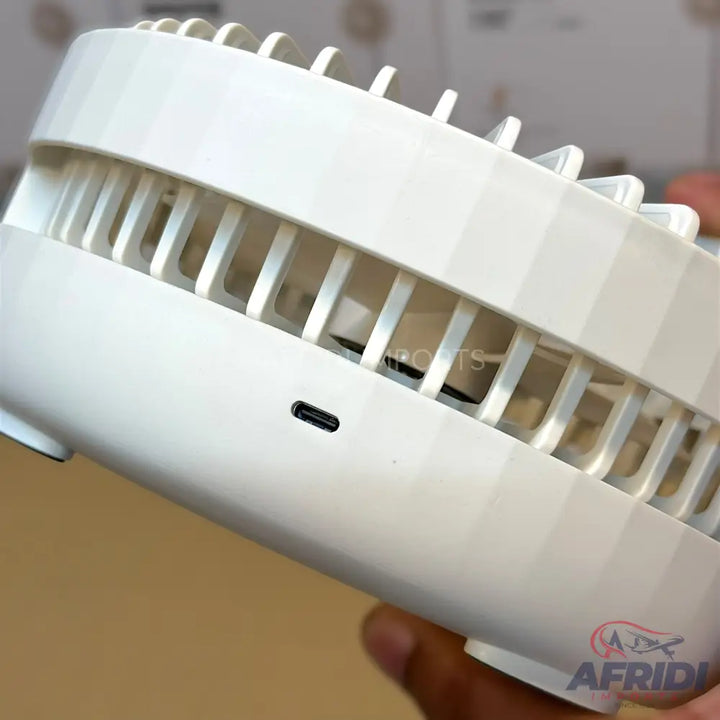 A white portable bladeless neck fan with a USB-C charging port.