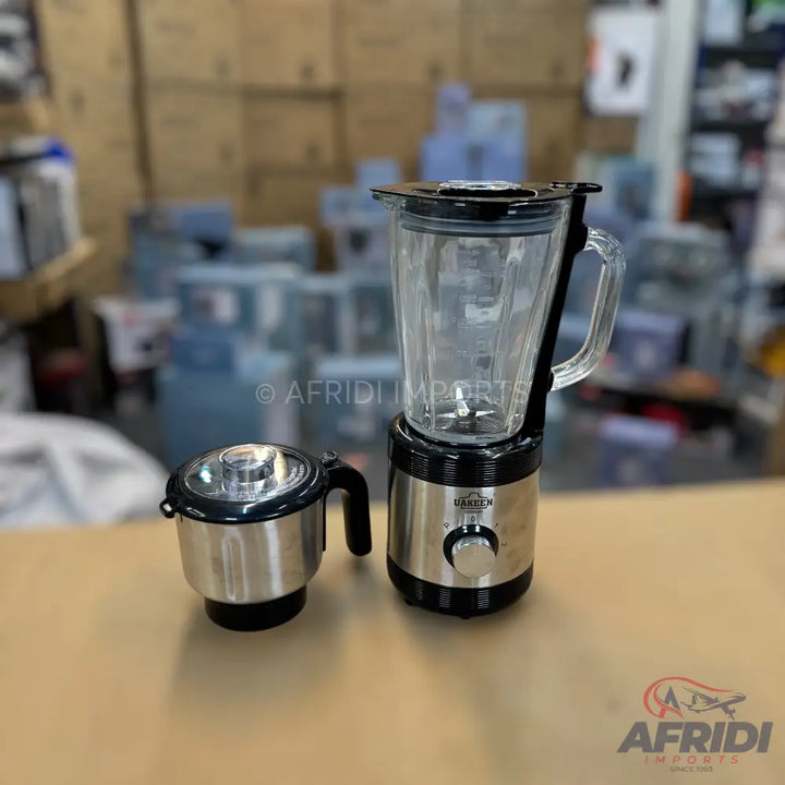 Stainless steel blender with a glass jar and an additional smaller grinding jar.