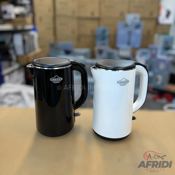 Two electric kettles, one black and one white, with insulated handles and silver-toned lids.