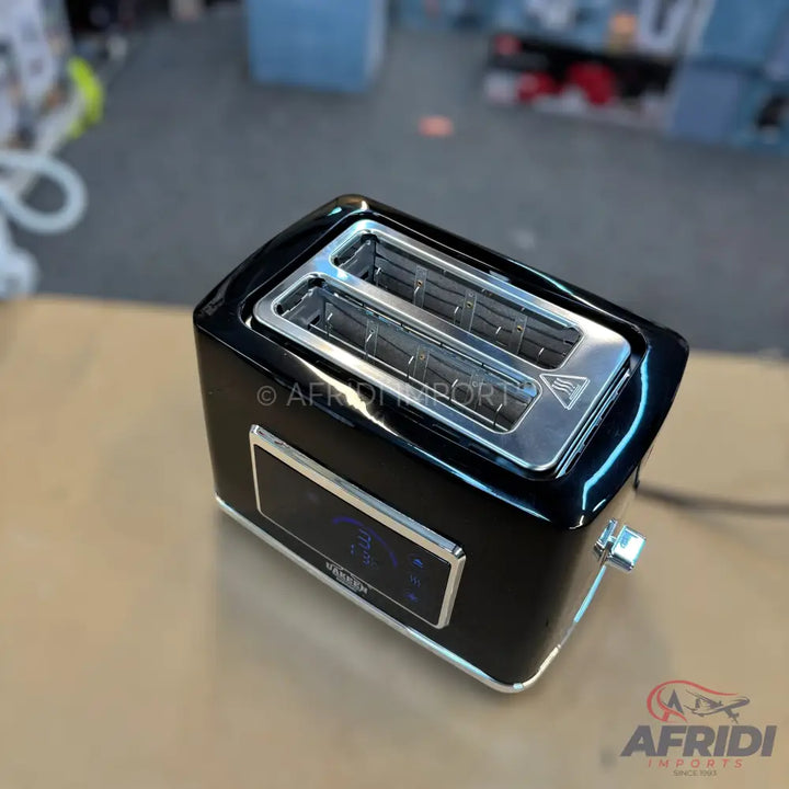 A sleek black two-slice toaster with a digital display.