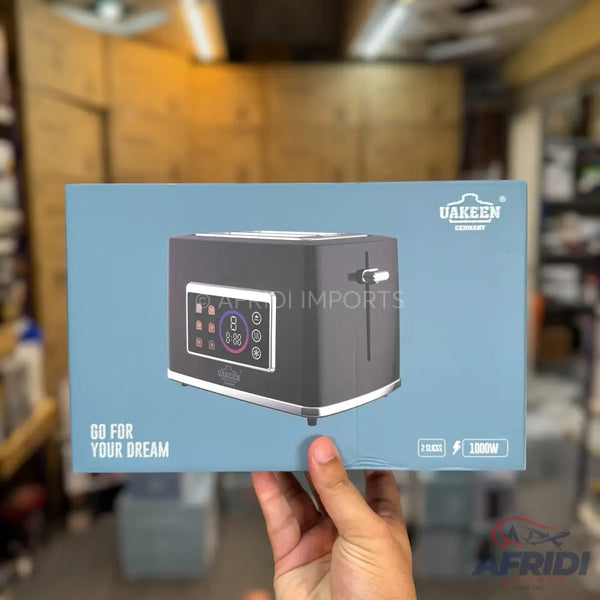 Box for a gray two-slice toaster with a digital display and silver accents.