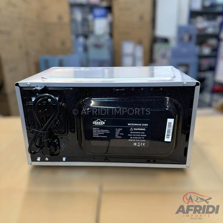 White microwave oven with a black back panel.