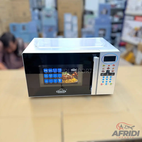 A black and silver microwave oven with a digital display and control panel.