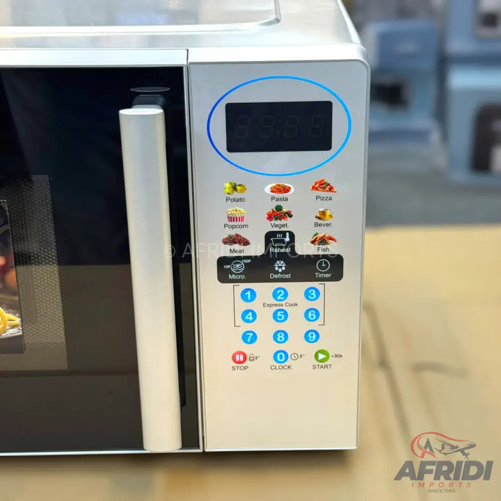 Silver microwave oven with a digital display and various cooking presets.