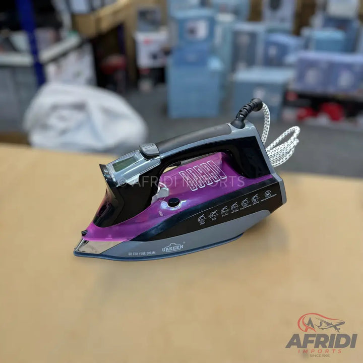 Purple and black steam iron with a digital display.