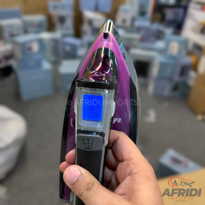 Purple and black handheld steam iron with a digital display.