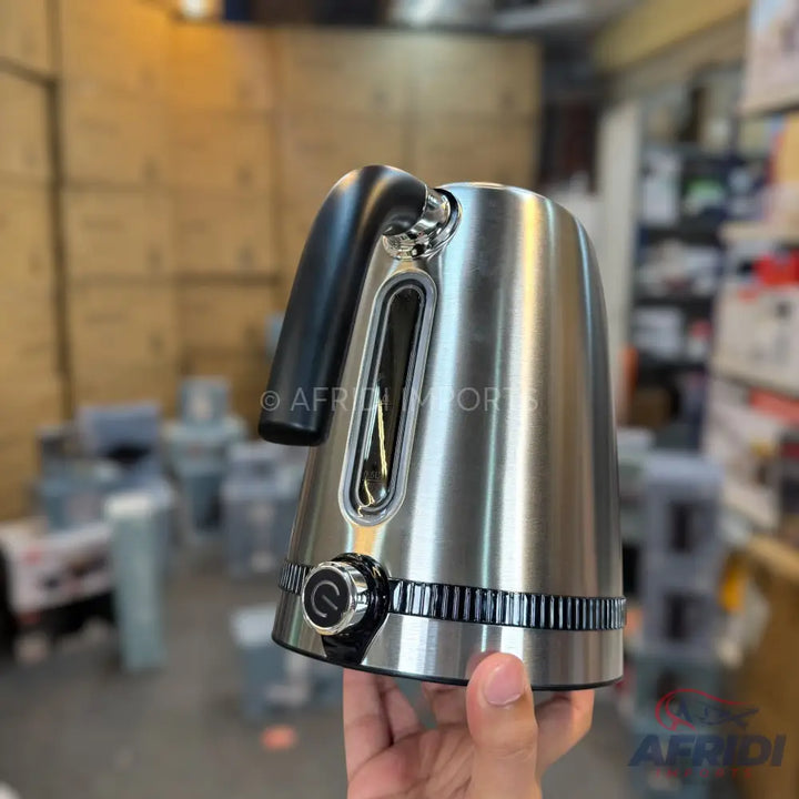 A sleek, silver electric kettle with a black handle and a water level indicator.