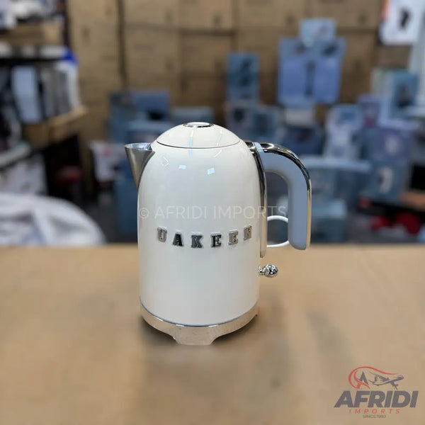 Cream-colored electric kettle with a chrome base and handle accents.